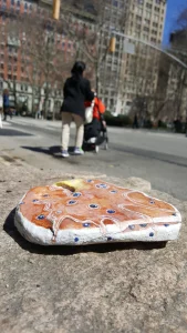 Elizabeth Saloka paints groceries and gadgets onto rocks – yep, rocks